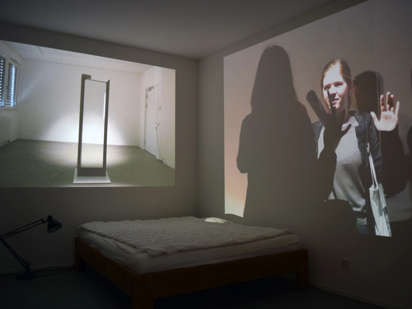 Reflection of visitors' images through mirrors merged with silhouettes, challenging gender and physical trait visual cues, inviting deep reflection on personal and collective identity